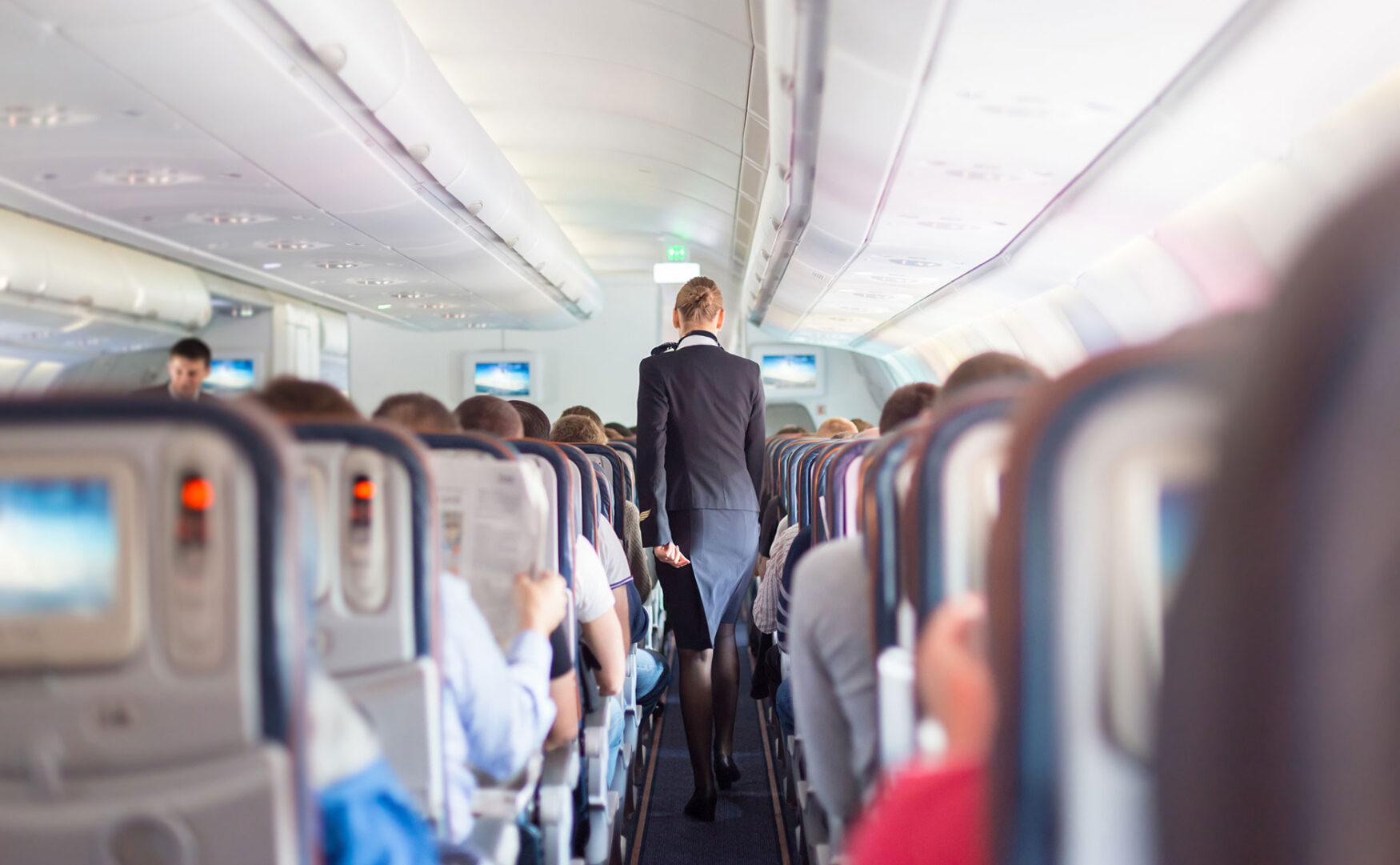 2-aisle airplane with flight attendant